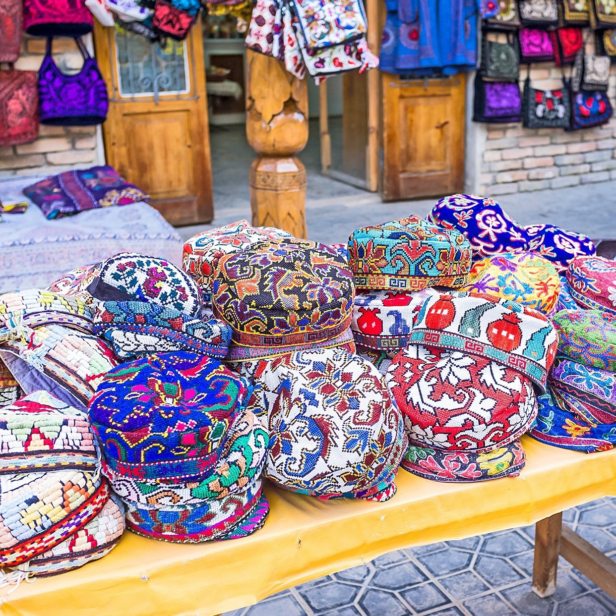 The traditional Uzbek cap, named tubeteika, duppi or kalpoq, decorated with multi colored embroidery, Bukhara, Uzbekistan.